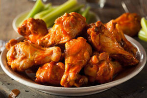 Spicy Homemade Buffalo Wings with Dip and Beer